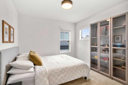 57 Riviera Crescent, Cochrane, AB - Indoor Photo Showing Bedroom