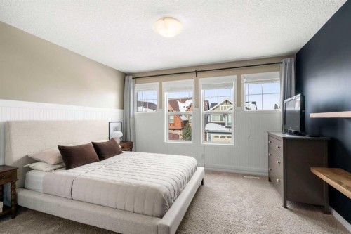 57 Riviera Crescent, Cochrane, AB - Indoor Photo Showing Bedroom