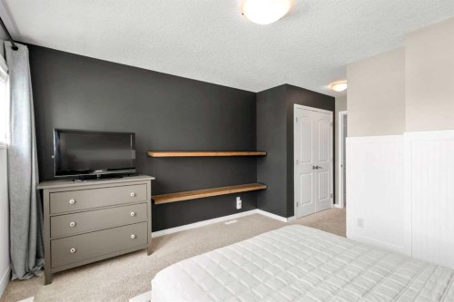 57 Riviera Crescent, Cochrane, AB - Indoor Photo Showing Bedroom