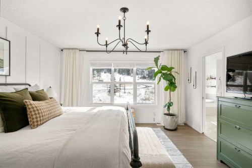 57 Riviera Crescent, Cochrane, AB - Indoor Photo Showing Bedroom