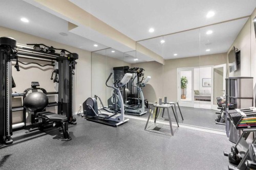 57 Riviera Crescent, Cochrane, AB - Indoor Photo Showing Gym Room