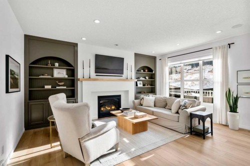 57 Riviera Crescent, Cochrane, AB - Indoor Photo Showing Living Room With Fireplace