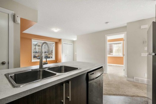 193-300 Marina Drive, Chestermere, AB - Indoor Photo Showing Kitchen With Double Sink
