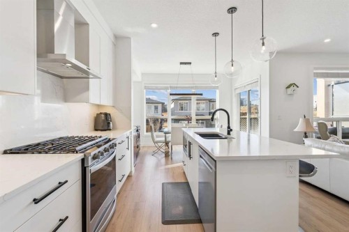 255-7820 Spring Willow Drive Sw, Calgary, AB - Indoor Photo Showing Kitchen With Double Sink With Upgraded Kitchen