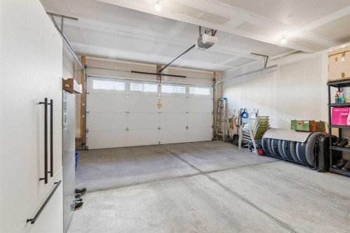 255-7820 Spring Willow Drive Sw, Calgary, AB - Indoor Photo Showing Garage