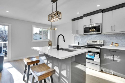 1306 Berkley Drive Nw, Calgary, AB - Indoor Photo Showing Kitchen With Double Sink With Upgraded Kitchen