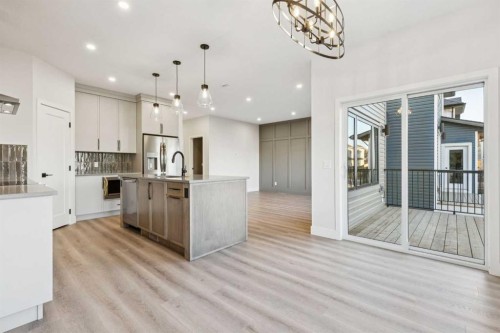 120 Quartz Crescent, Cochrane, AB - Indoor Photo Showing Kitchen With Upgraded Kitchen