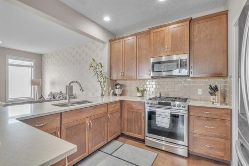 145 Walden Park Se, Calgary, AB - Indoor Photo Showing Kitchen With Double Sink