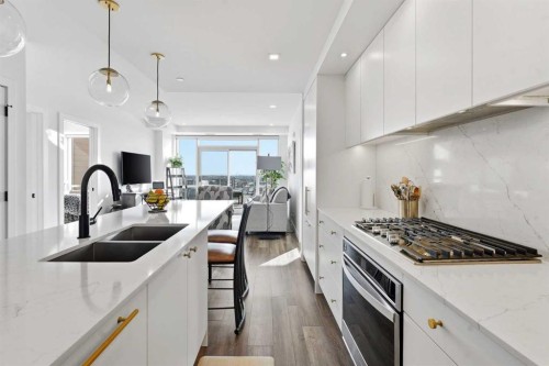 710-8505 Broadcast Avenue Sw, Calgary, AB - Indoor Photo Showing Kitchen With Double Sink With Upgraded Kitchen
