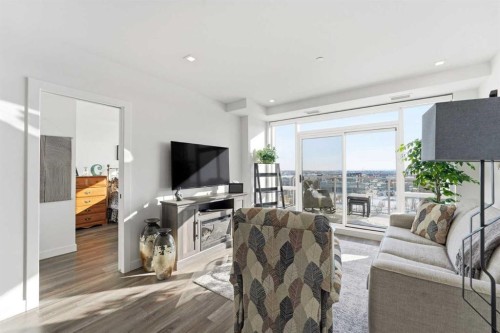 710-8505 Broadcast Avenue Sw, Calgary, AB - Indoor Photo Showing Living Room