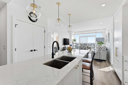 710-8505 Broadcast Avenue Sw, Calgary, AB - Indoor Photo Showing Kitchen With Double Sink With Upgraded Kitchen