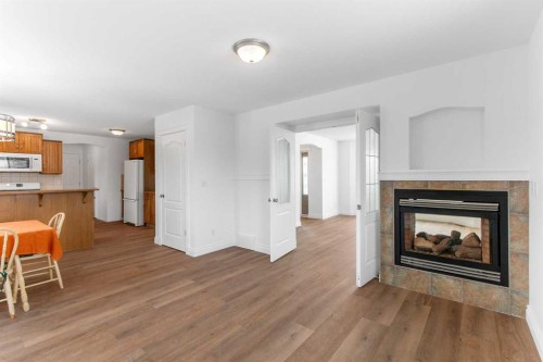 763 Stonehaven Drive, Carstairs, AB - Indoor Photo Showing Living Room With Fireplace