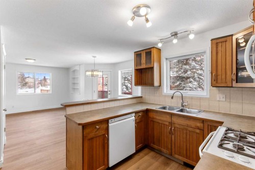 763 Stonehaven Drive, Carstairs, AB - Indoor Photo Showing Kitchen With Double Sink