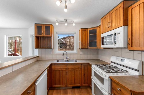 763 Stonehaven Drive, Carstairs, AB - Indoor Photo Showing Kitchen With Double Sink