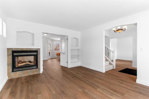 763 Stonehaven Drive, Carstairs, AB - Indoor Photo Showing Living Room With Fireplace