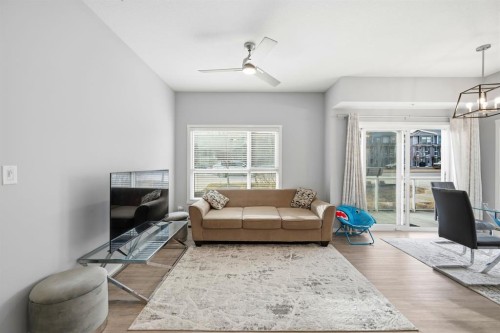 101-4250 Seton Drive Se, Calgary, AB - Indoor Photo Showing Living Room
