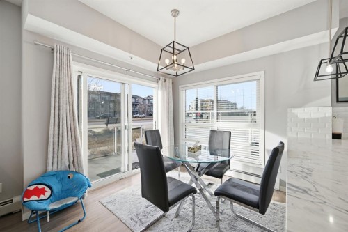 101-4250 Seton Drive Se, Calgary, AB - Indoor Photo Showing Dining Room
