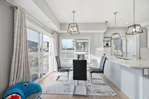 101-4250 Seton Drive Se, Calgary, AB - Indoor Photo Showing Dining Room