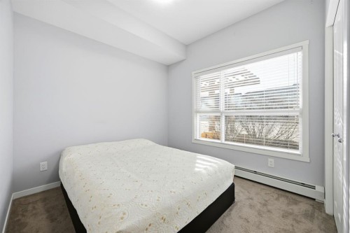 101-4250 Seton Drive Se, Calgary, AB - Indoor Photo Showing Bedroom