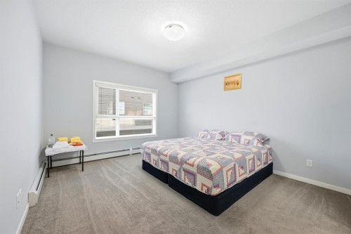 101-4250 Seton Drive Se, Calgary, AB - Indoor Photo Showing Bedroom