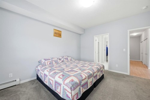 101-4250 Seton Drive Se, Calgary, AB - Indoor Photo Showing Bedroom