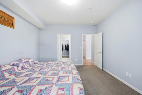101-4250 Seton Drive Se, Calgary, AB - Indoor Photo Showing Bedroom