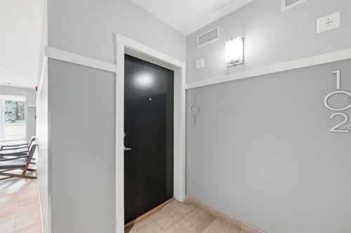 101-4250 Seton Drive Se, Calgary, AB - Indoor Photo Showing Other Room
