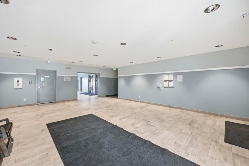 101-4250 Seton Drive Se, Calgary, AB - Indoor Photo Showing Other Room