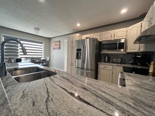 200 Hawkbury Close Nw, Calgary, AB - Indoor Photo Showing Kitchen With Stainless Steel Kitchen With Double Sink