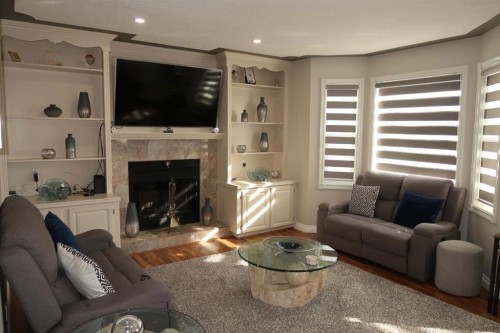 200 Hawkbury Close Nw, Calgary, AB - Indoor Photo Showing Living Room With Fireplace