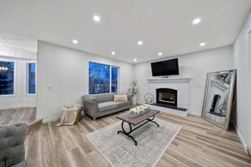 16 Sandringham Close Nw, Calgary, AB - Indoor Photo Showing Living Room With Fireplace