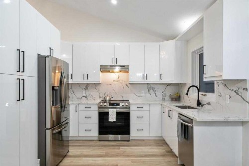 16 Sandringham Close Nw, Calgary, AB - Indoor Photo Showing Kitchen With Stainless Steel Kitchen With Upgraded Kitchen