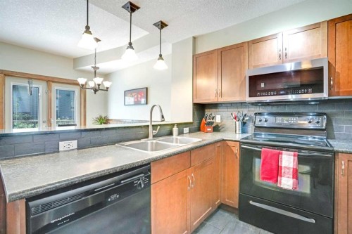 102-121 Kananaskis Way, Canmore, AB - Indoor Photo Showing Kitchen With Double Sink