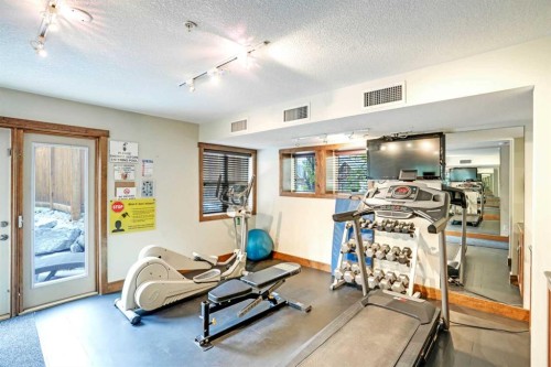 102-121 Kananaskis Way, Canmore, AB - Indoor Photo Showing Gym Room