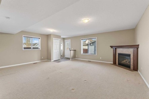 250 Silverado Plains Close Sw, Calgary, AB - Indoor With Fireplace