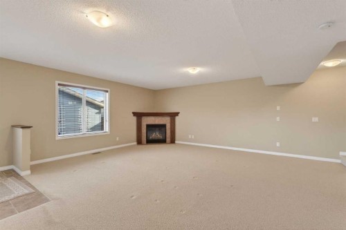 250 Silverado Plains Close Sw, Calgary, AB - Indoor With Fireplace