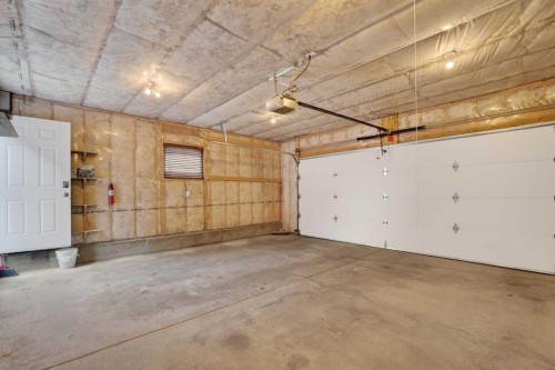 250 Silverado Plains Close Sw, Calgary, AB - Indoor Photo Showing Garage