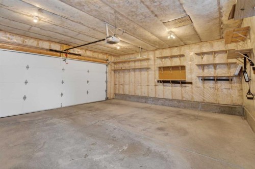 250 Silverado Plains Close Sw, Calgary, AB - Indoor Photo Showing Garage