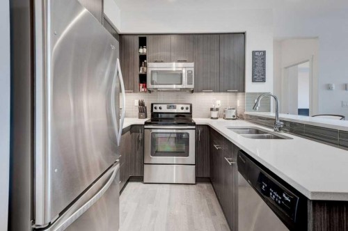 3101-175 Silverado Boulevard Sw, Calgary, AB - Indoor Photo Showing Kitchen With Stainless Steel Kitchen With Double Sink With Upgraded Kitchen