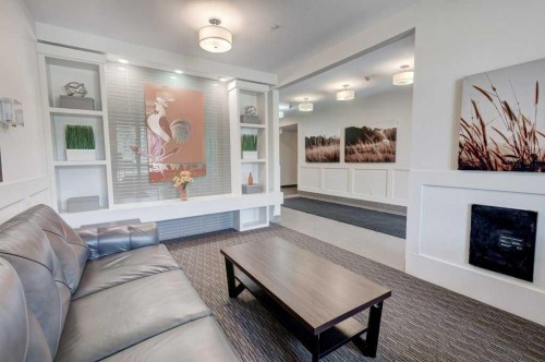 3101-175 Silverado Boulevard Sw, Calgary, AB - Indoor Photo Showing Living Room With Fireplace