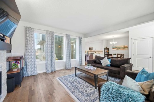 8 Redstone Passage Ne, Calgary, AB - Indoor Photo Showing Living Room With Fireplace