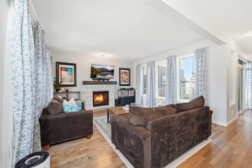 8 Redstone Passage Ne, Calgary, AB - Indoor Photo Showing Living Room With Fireplace