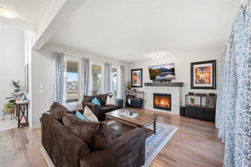 8 Redstone Passage Ne, Calgary, AB - Indoor Photo Showing Living Room With Fireplace