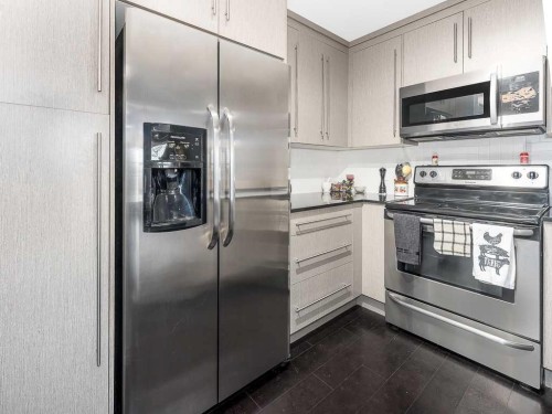 1203-11 Mahogany Row Se, Calgary, AB - Indoor Photo Showing Kitchen With Stainless Steel Kitchen