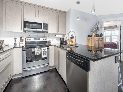 1203-11 Mahogany Row Se, Calgary, AB - Indoor Photo Showing Kitchen With Stainless Steel Kitchen