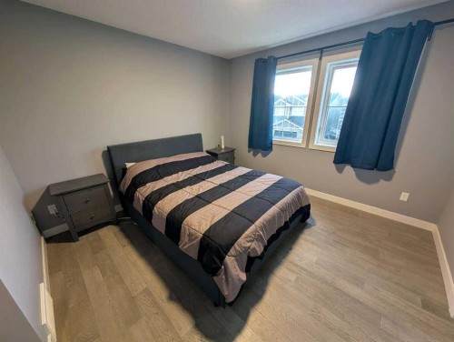 72 Sundown Crescent, Cochrane, AB - Indoor Photo Showing Bedroom