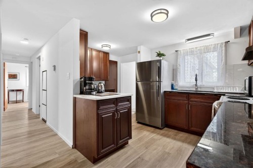 209 Sunset Boulevard Sw, Diamond Valley, AB - Indoor Photo Showing Kitchen