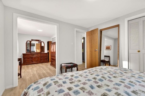 209 Sunset Boulevard Sw, Diamond Valley, AB - Indoor Photo Showing Bedroom