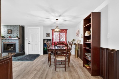 209 Sunset Boulevard Sw, Diamond Valley, AB - Indoor With Fireplace