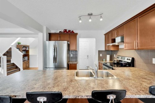 209 Windford Park Sw, Airdrie, AB - Indoor Photo Showing Kitchen With Stainless Steel Kitchen With Double Sink